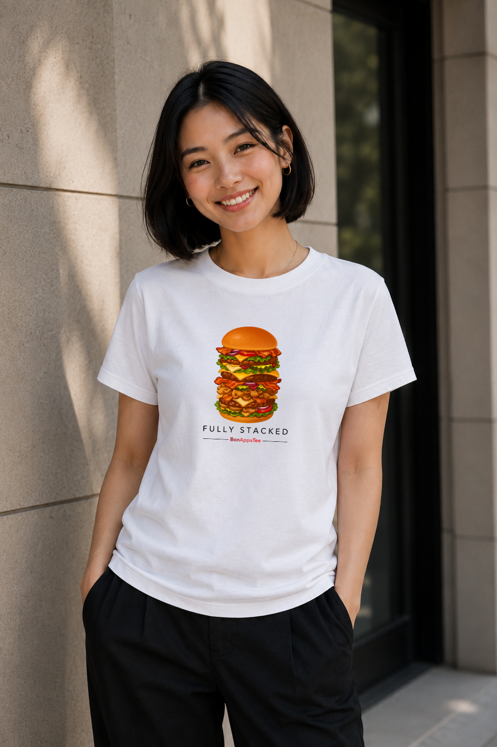 Female wearing Fully Stacked Tee — burger graphic on premium relaxed fit white T-shirt by BonAppaTee