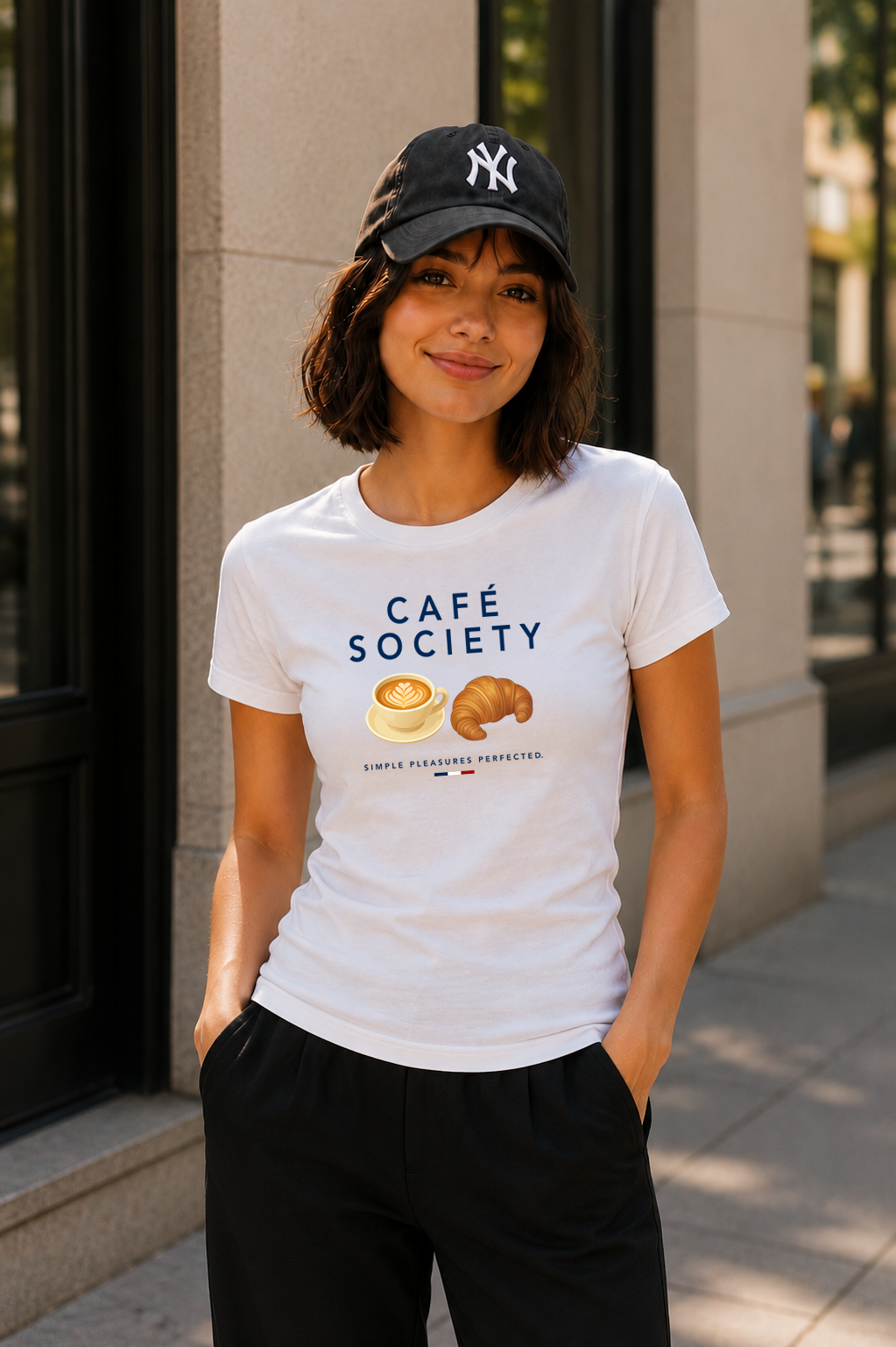 Female wearing Cafe Society Tee — cappuccino and croissant graphic on premium relaxed fit white T-shirt by BonAppaTee