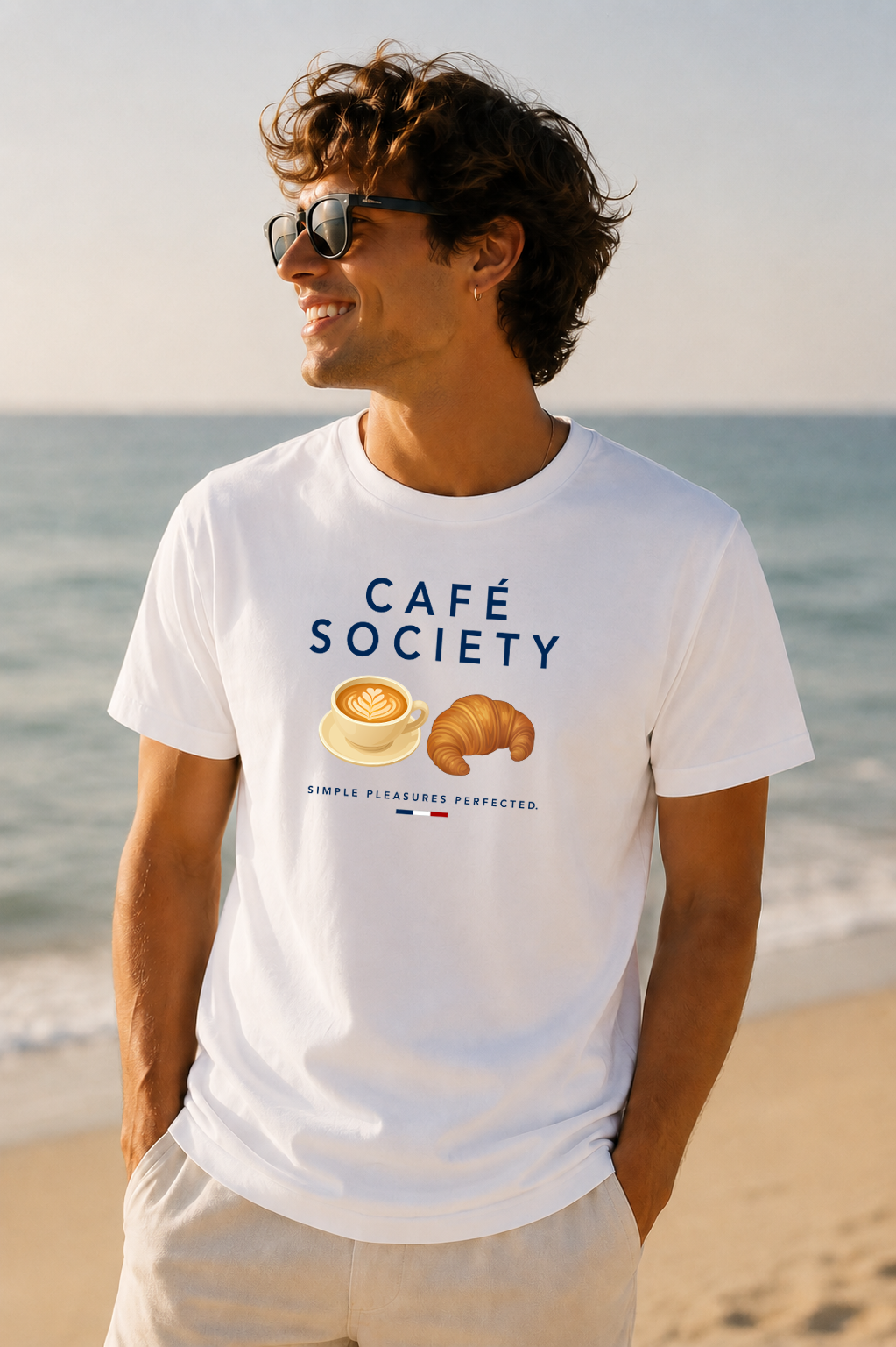 Male wearing Cafe Society Tee — cappuccino and croissant graphic on premium relaxed fit white T-shirt by BonAppaTee