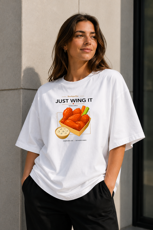 Female wearing Just Wing It Tee — chicken wings graphic on premium oversized white T-shirt by BonAppaTee