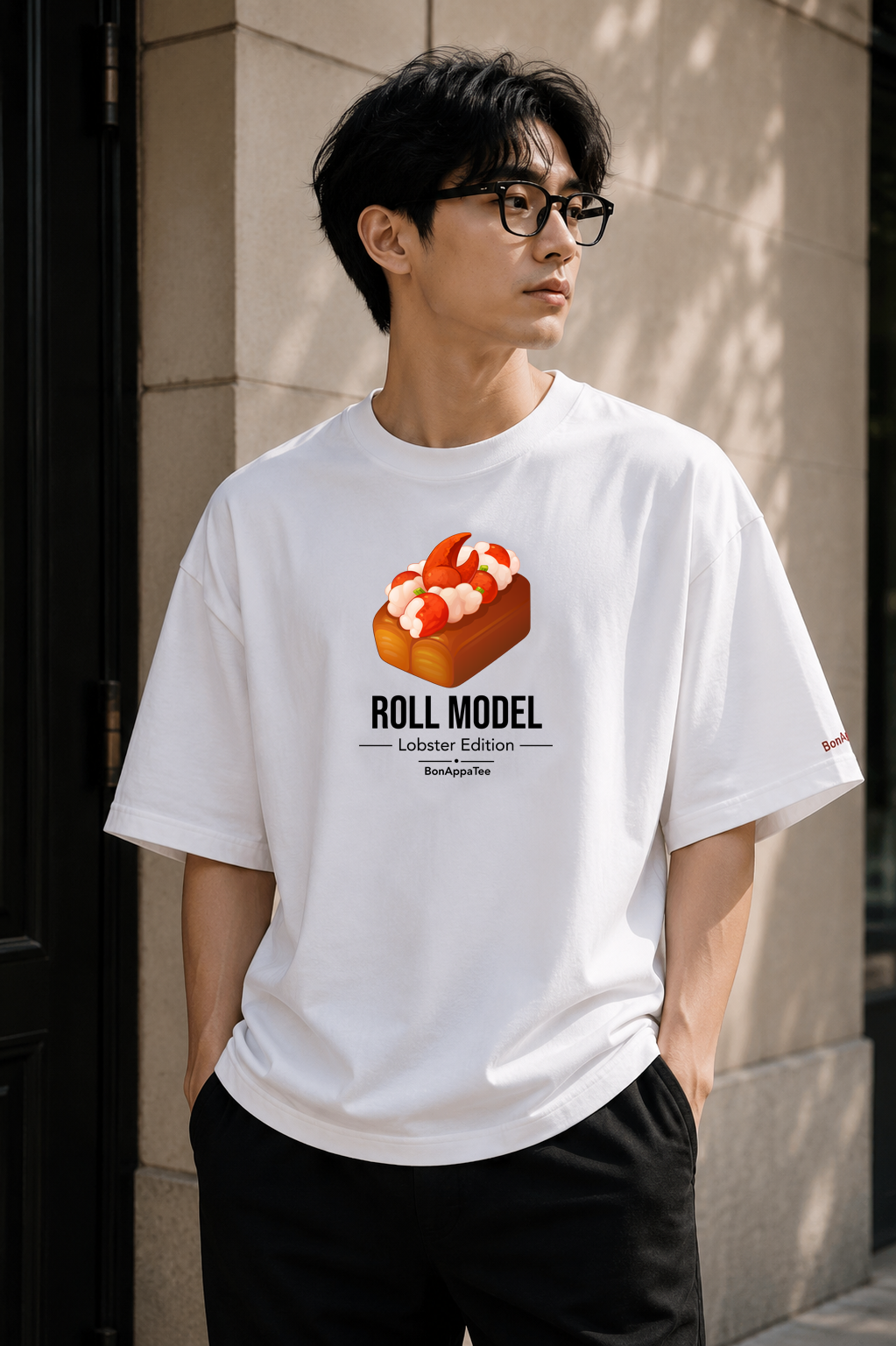Male wearing Roll Model Lobster Edition Tee — lobster graphic on premium oversized white T-shirt by BonAppaTee