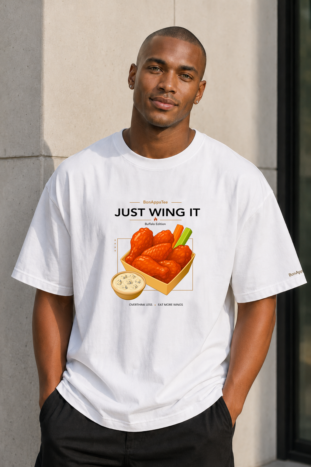 Male wearing Just Wing It Tee — chicken wings graphic on premium oversized white T-shirt by BonAppaTee